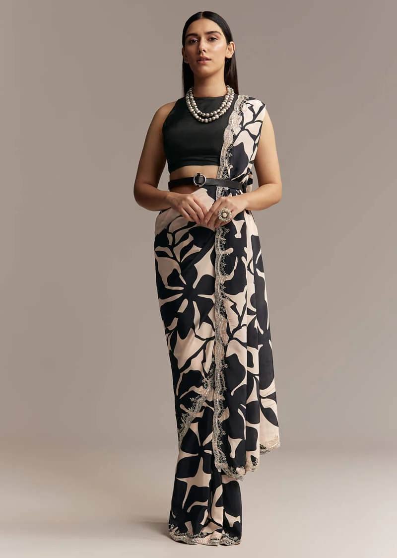Beige Crepe Saree With Black Floral Print And Embellished Border